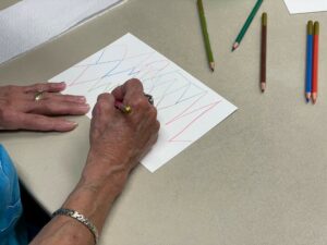 A participant experiments with abstract art.
