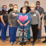 Sherri Holder (center) with her UAMS care team on H4. Holder was UAMS' first ECMO patient.