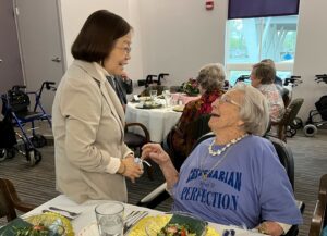 Institute on Aging Director Jeanne Wei, M.D., talks with Kathryn Bost.