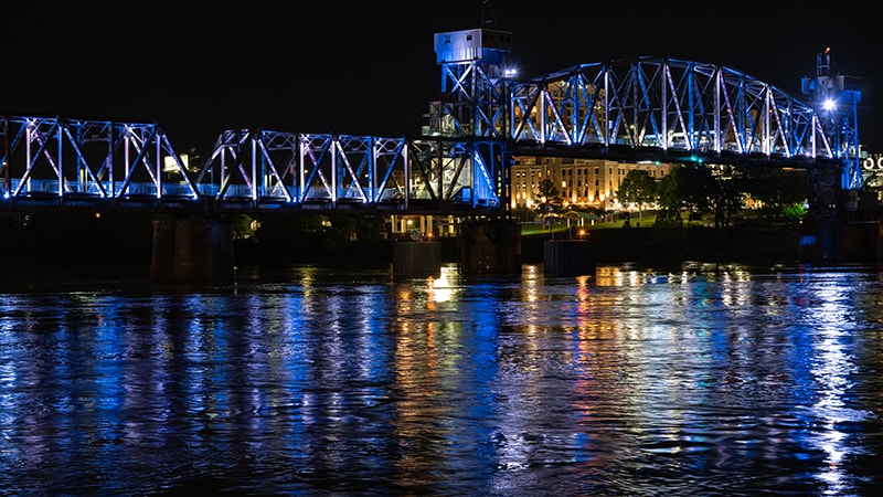 On Friday evening, office buildings and bridges across the Arkansas River were lit up in blue and white lights in tribute to nurses across Arkansas. 