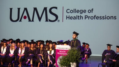 After the hooding ceremony, Thi Minh Cao, a physician assistant student, speaks on behalf of the graduates.