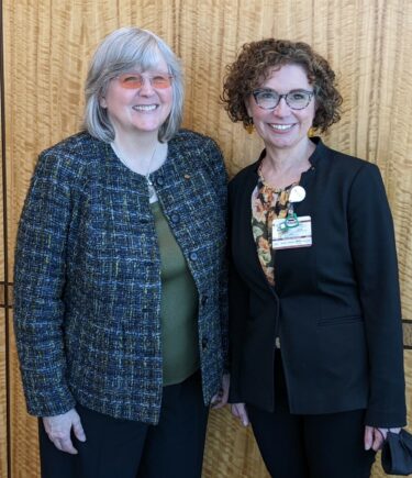 Sara Shalin, M.D., Ph.D., (right), who chairs the Department of Dermatology at UAMS, with guest lecturer Sancy Leachman, M.D., Ph.D.