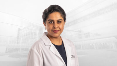 Kalaivani Sivakumar, M.D., in white coat