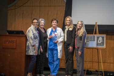 This year’s UAMS Nursing Legacy Award honoree was Julie Atkins, center, senior nursing director for the Emergency Medicine Service Line. With Atkins, left to right, Trenda Ray, Mary Helen Forrest, Allison Atkinson.