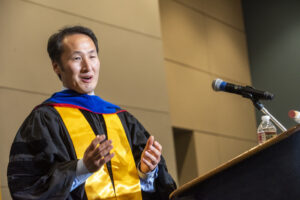 Sung Rhee, Ph.D., was chosen by the class to present the faculty charge.