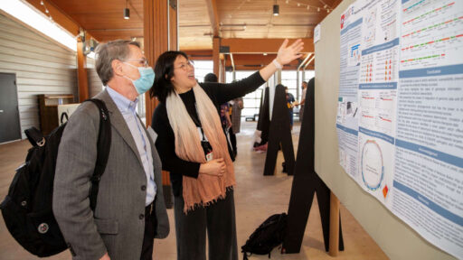 Se-Ran Jun, Ph.D., discusses her TRI pilot award-supported findings with Fred Prior, Ph.D., distinguished professor and chair of the Department of Biomedical Informatics, at TRI Research Day in April.