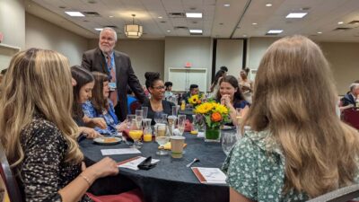 Robert McGehee, Ph.D., dean of the Graduate School, visits with the Class of 2022 during their Commencement Day brunch the morning of graduation.