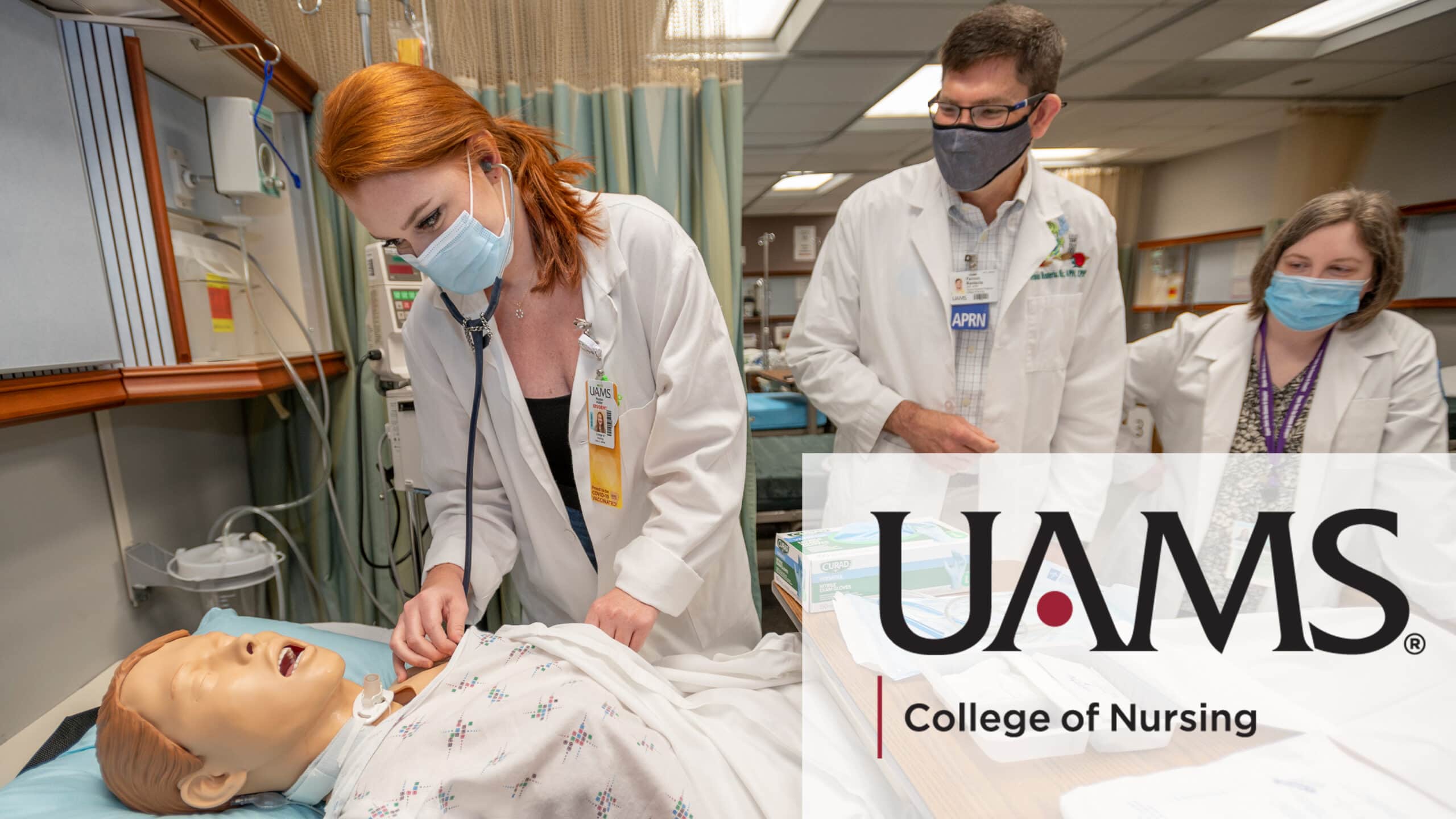 A nursing student practices on a simulation dummy.