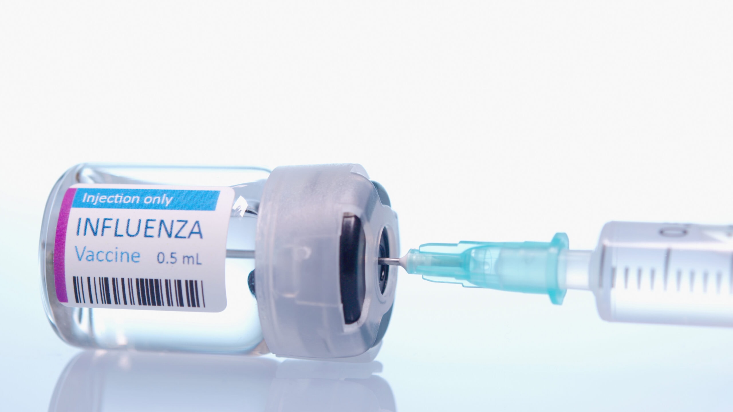 Influenza vaccine vial and syringe