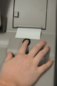 A UAMS nursing student scans her finger to access the Pyxis medication system.