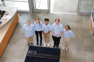 MASH students pose in the lobby of Northwest Medical Center in Harrison.