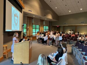 Lauren Haggard-Duff, the accelerated BSN program director, prepares to lead the UAMS BSN Class of 2023 in reciting the Nightingale Pledge.