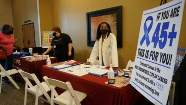 UAMS' Karen Crowell, M.D. (right), and Crystal Croswell helped attendees sign up for yearly at-home colorectal screening tests. 