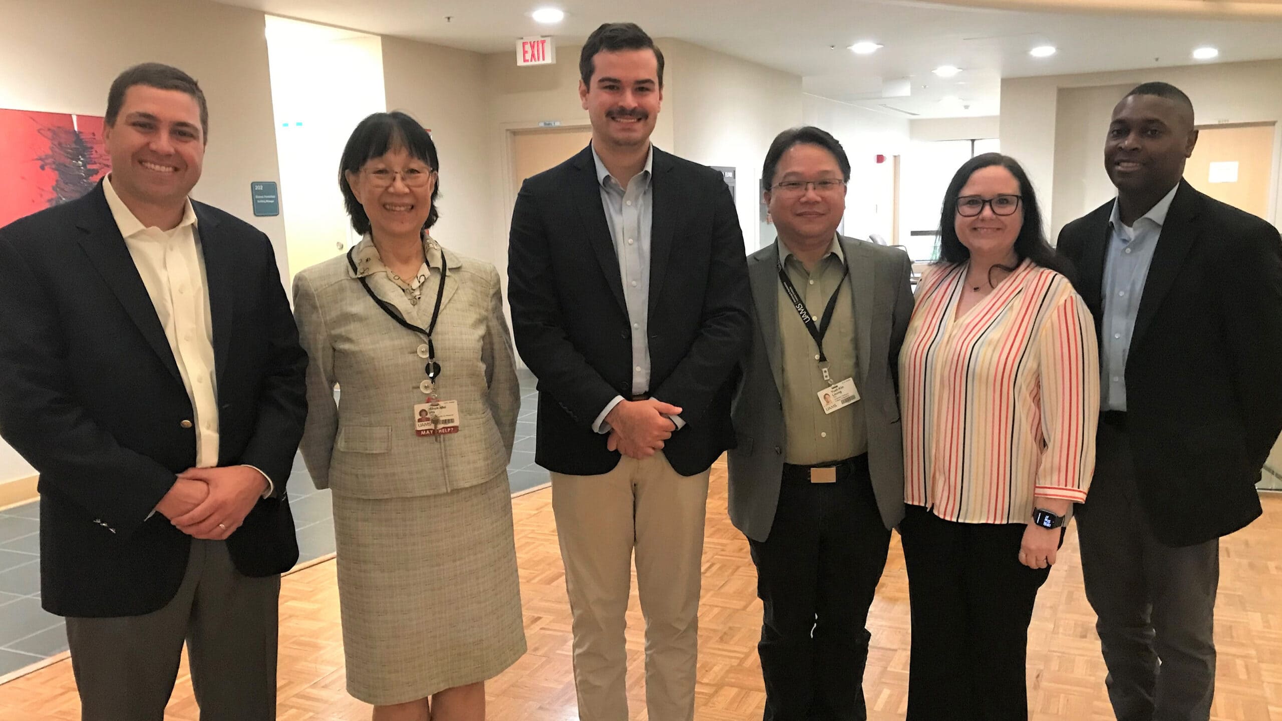 After their meeting, members of Sen. John Boozman’s staff posed with UAMS researchers (l-r) Patrick McGuigan (Boozman), Shuk-Mei Ho, Ph.D., Bradley Plunkett (Boozman), Yuet-Kin Leung, Ph.D., Mary Shepard and Labaron King (Boozman).