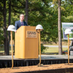 University of Arkansas for Medical Sciences (UAMS) Chancellor Cam Patterson speaks Wednesday during the groundbreaking ceremony for the Child Development Center project in Little Rock.