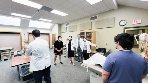 Amelia Allert, second from left, a legislative assistant in the Office of U.S. Rep. French Hill, visits with Physician Assistant Studies students at UAMS.