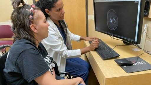 Analiz Rodriguez, M.D., shows Ashley James an image of her brain.