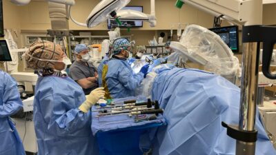 Noojan Kazemi, M.D., performs a prone lateral lumbar fusion as Professor Greg Malham observes.