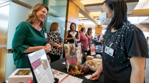 Veronica Smith, who directs the UAMS Rural Research Network, speaks with Ruiqi Cen, Ph.D., a postdoctoral fellow in the Fay W. Boozman College of Public. Health.