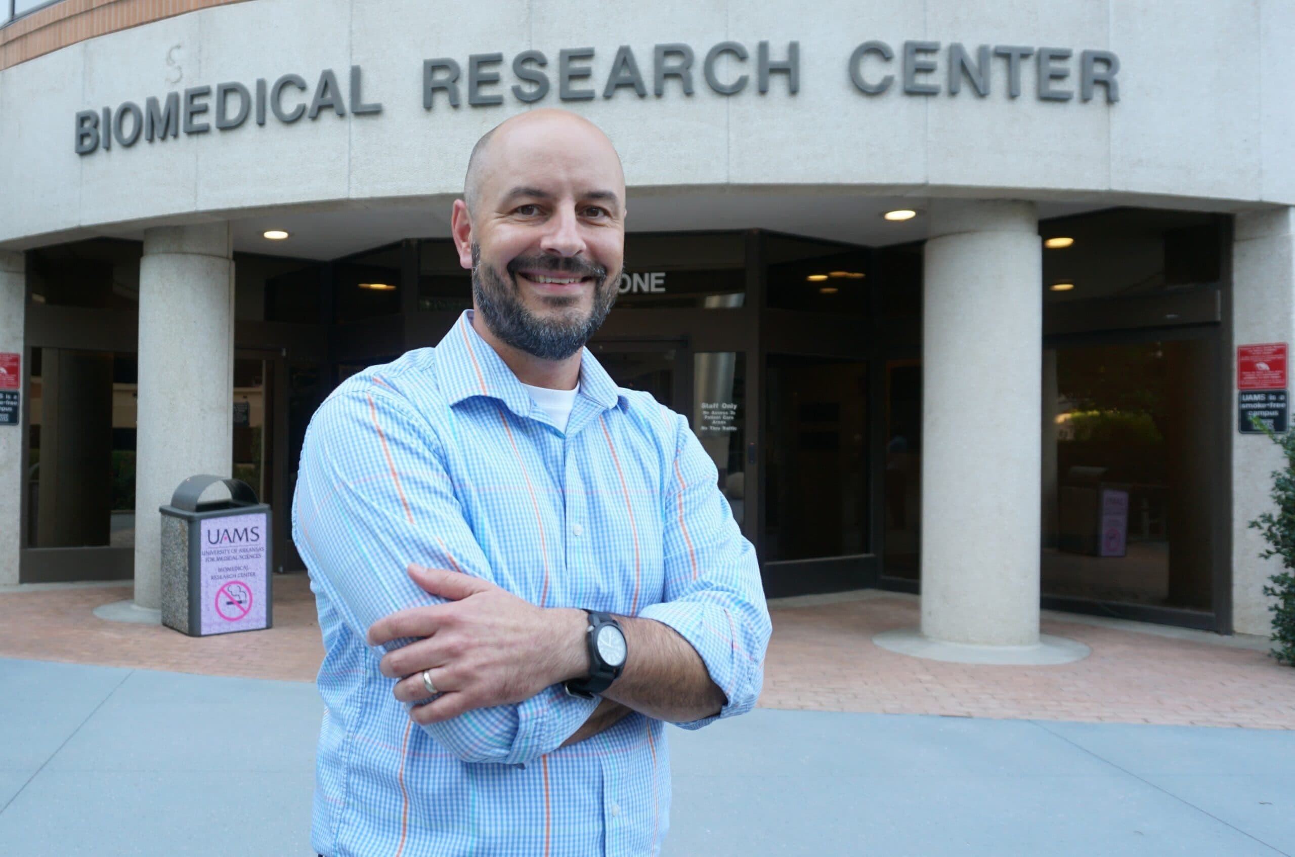 Daniel Voth UAMS, Ph.D., led an NIH grant supporting renovations to enhance the infectious disease research space in the building behind him.