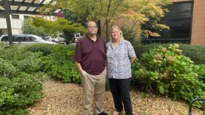 Terry Fortner stands next to his wife, Robbie, outside UAMS