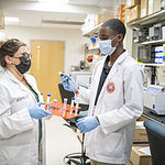 A Health Career University student works with an instructor in a lab at the University of Arkansas for Medical Sciences.