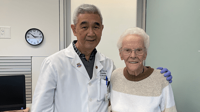patient standing with her doctor
