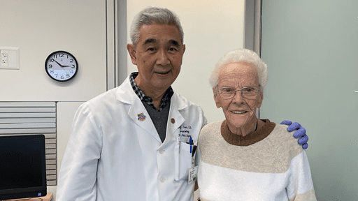 patient standing with her doctor