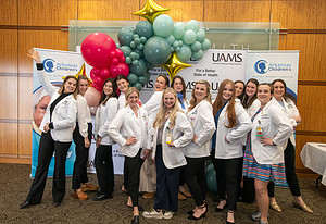 Students from the College of Medicine, along with nurses and residents, volunteered to assist with the Girlology event.