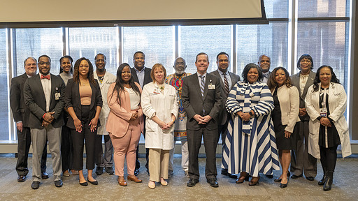 UAMS leaders and members of the Black History Wall of Honor Exhibit stand together after the closing ceremony.