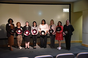 Several of the 2020 Phenomenal Women honorees gather onstage with their awards. The 2020 recipients were honored with a video tribute during this year's ceremony.