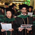Graduates recite the Hippocratic Oath as part of becoming physicians.