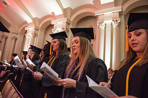 Graduates recite the Florence Nightingale Pledge during the hooding and pinning ceremony.