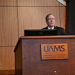 John Dornhoffer, M.D., chairman of the Department of Otolaryngology – Head and Neck Surgery in the UAMS College of Medicine, welcomes attendees from the stage on the first day of the Otolaryngology Diamond Conference.