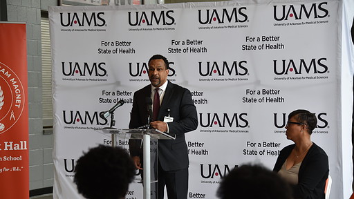 Brian Gittens, vice chancellor of the Division for Diversity, Equity and Inclusion, speaks during the press conference announcing UAMS' partnership with Hall STEAM Magnet High School.