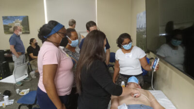 UAMS faculty members take part in a training session on point-of-care ultrasound technology. The expansion of point-of-care ultrasound training for medical students is among the projects that UAMS plans to implement using the new grant funding.