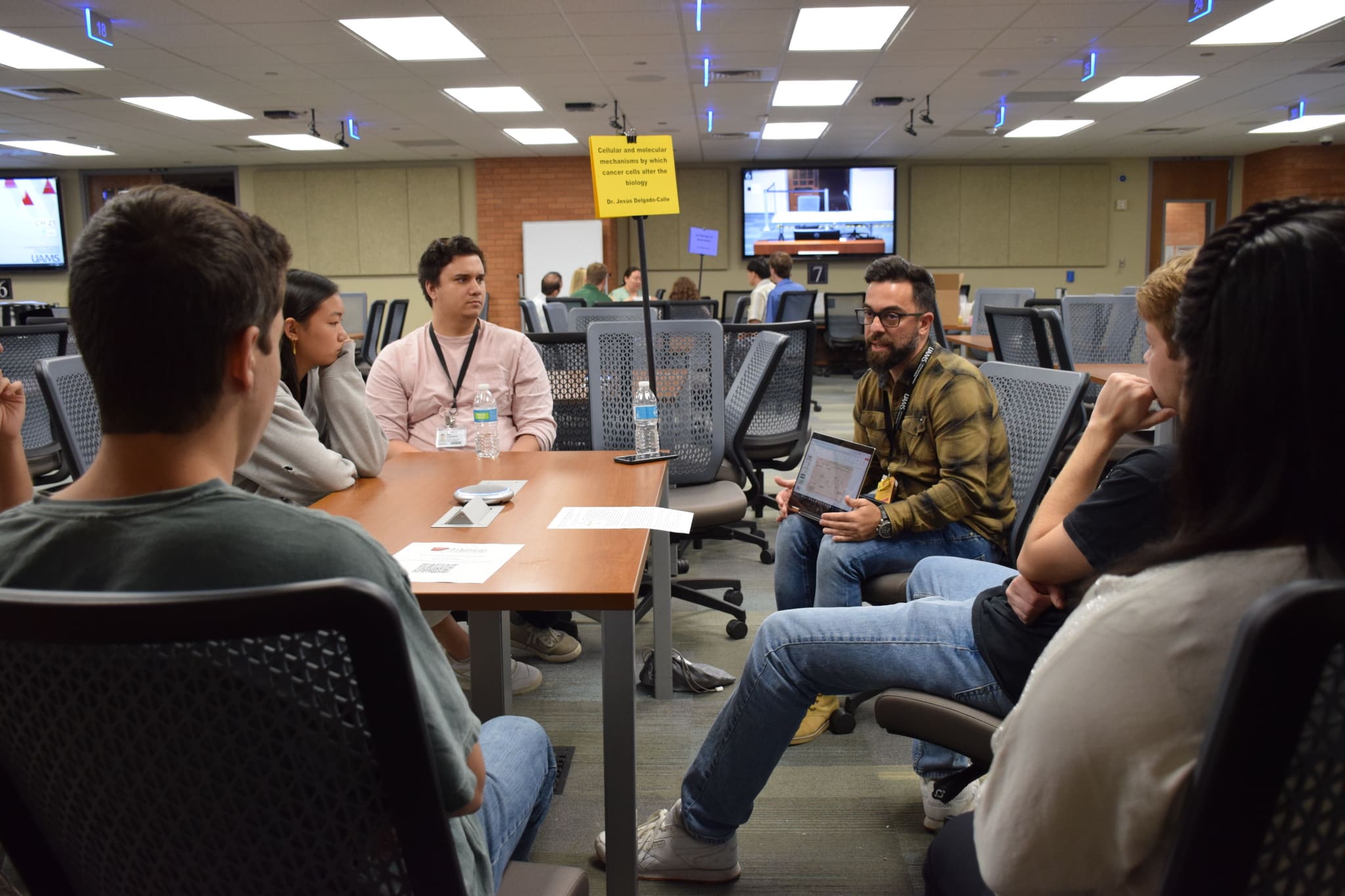 Jesus Delgado-Calle, an assistant professor of physiology and cell biology at UAMS, discusses his research with undergraduates and his team.