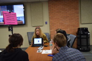 Professor Maria Schuller, Ph.D., discusses musculoskeletal disease research as students listen.