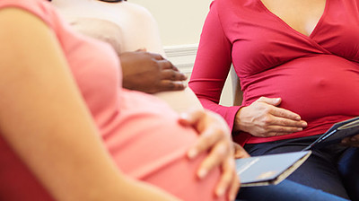 A group of pregnant women discussing their prenatal needs.