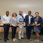 Seven of the Excellence in Mentoring Award recipients pose for a photo after the June 14 ceremony.