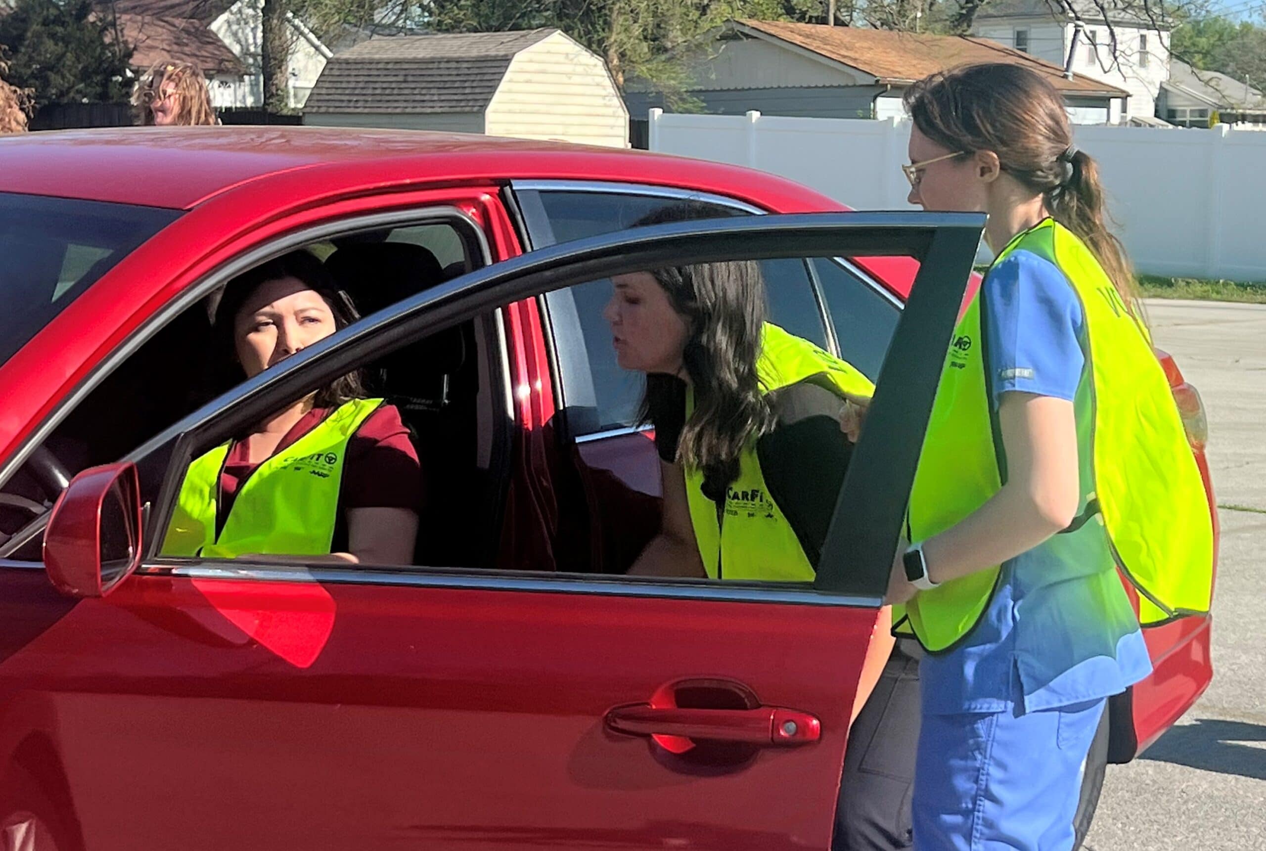 Occupational Therapy professor Kandy Salter works with OT students on how to properly check a person's car for their specific fit.