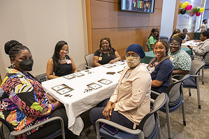 A group of people enjoys a game of bingo during the event.