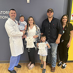 Haley Clark, her husband Seth and their two children Owen and Lilly are flanked by Adam Sandlin, M.D., and his APRN, Brooke Keathley.
