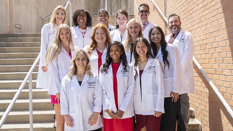 Audiology faculty and students gather for a photo after the August 2023 White Coat Ceremony.