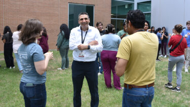 Mohamed Elasri visits with students at the ice cream social.