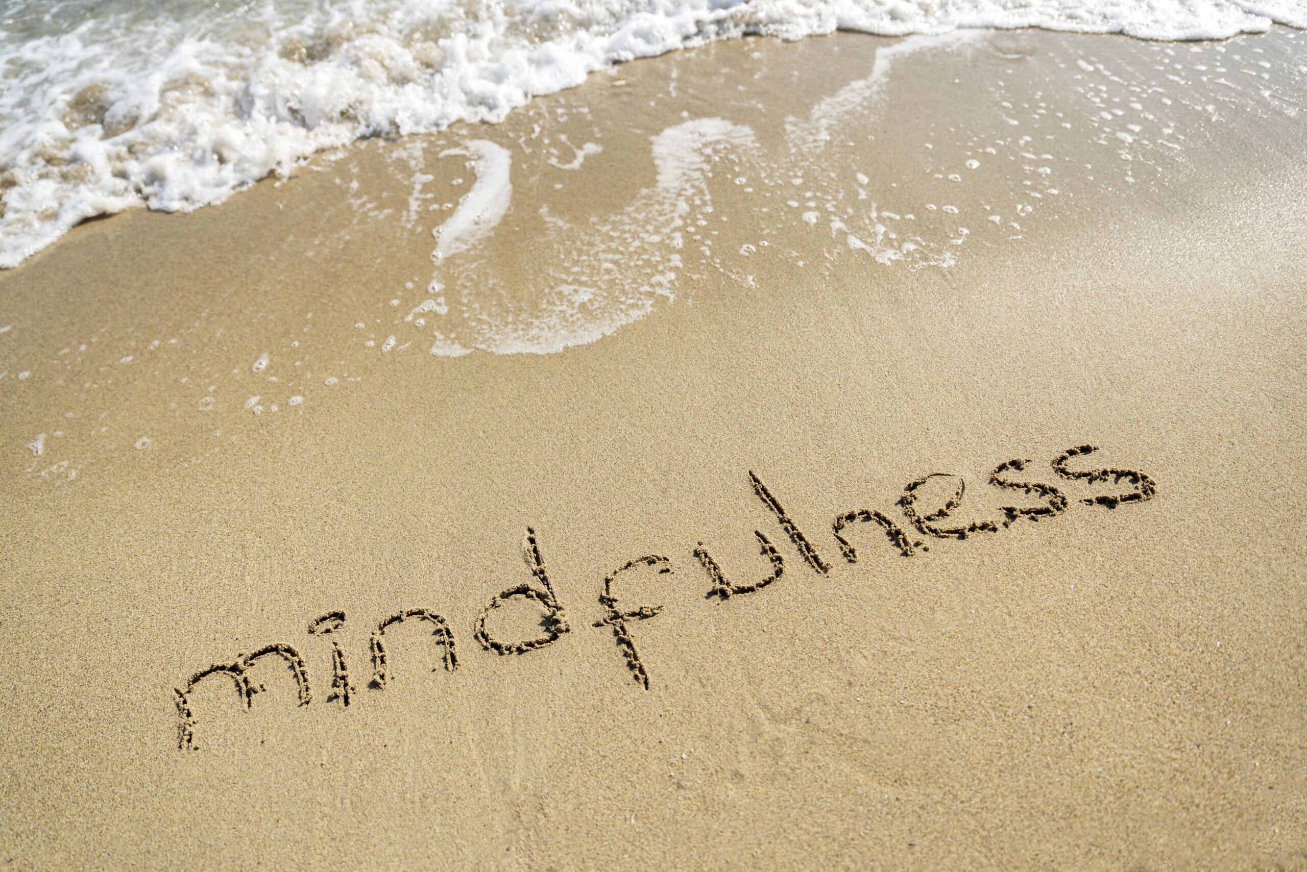 Mindfullness written in sand