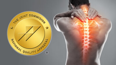 JC gold seal and photo of a person's back with spine highlighted