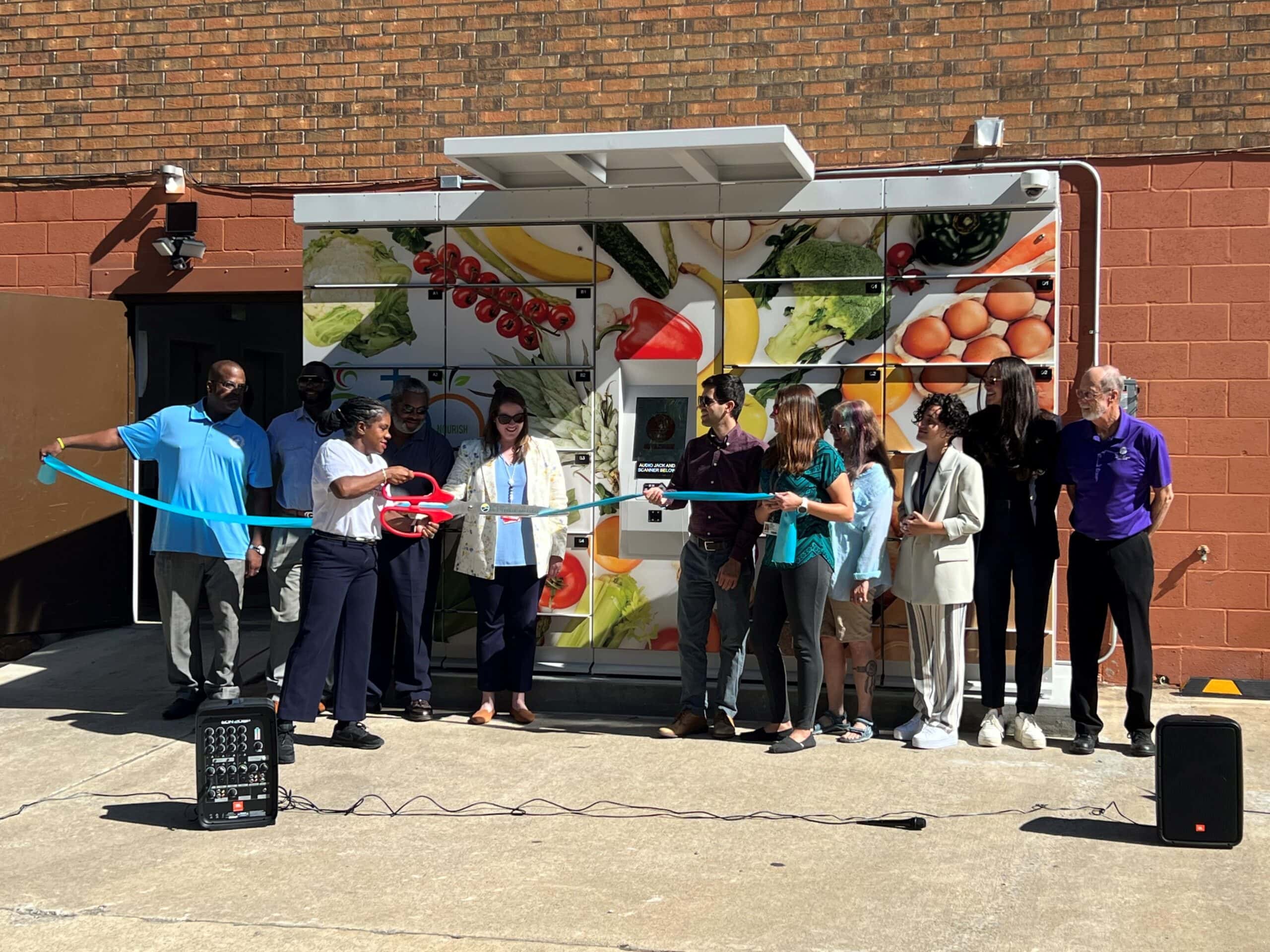 UAMS), the Northwest Arkansas Food Insecurity Community of Practice and the St. James Missionary Baptist Church and community leaders cut the ribbon at the new food lockers.