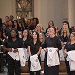 Students stand during the College of Nursing's white coat ceremony.