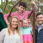 Cam Deacon (right) with his wife, Lauren, and their two children.